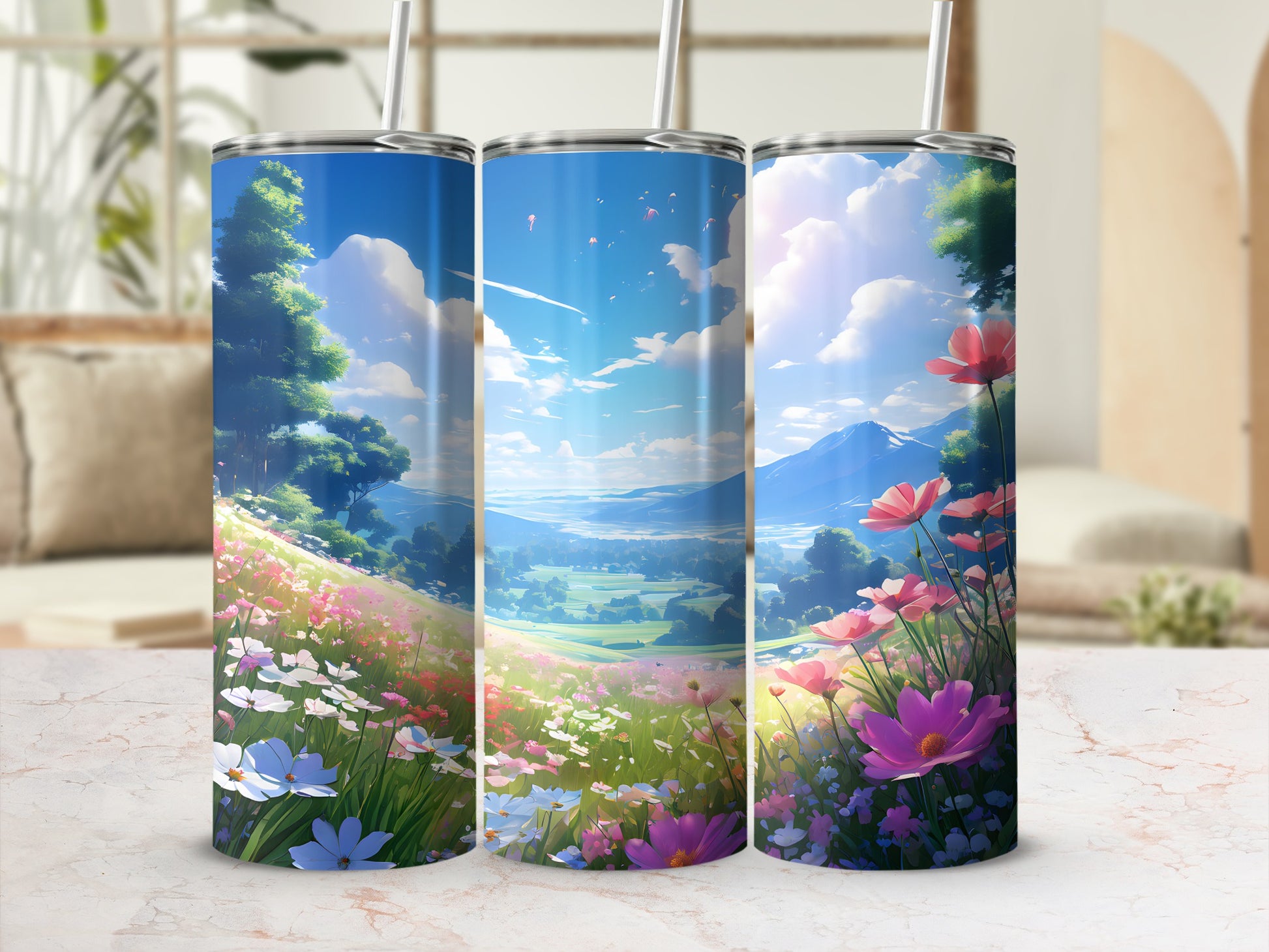 Three tumblers with a scenic landscape of rolling hills and flowers.