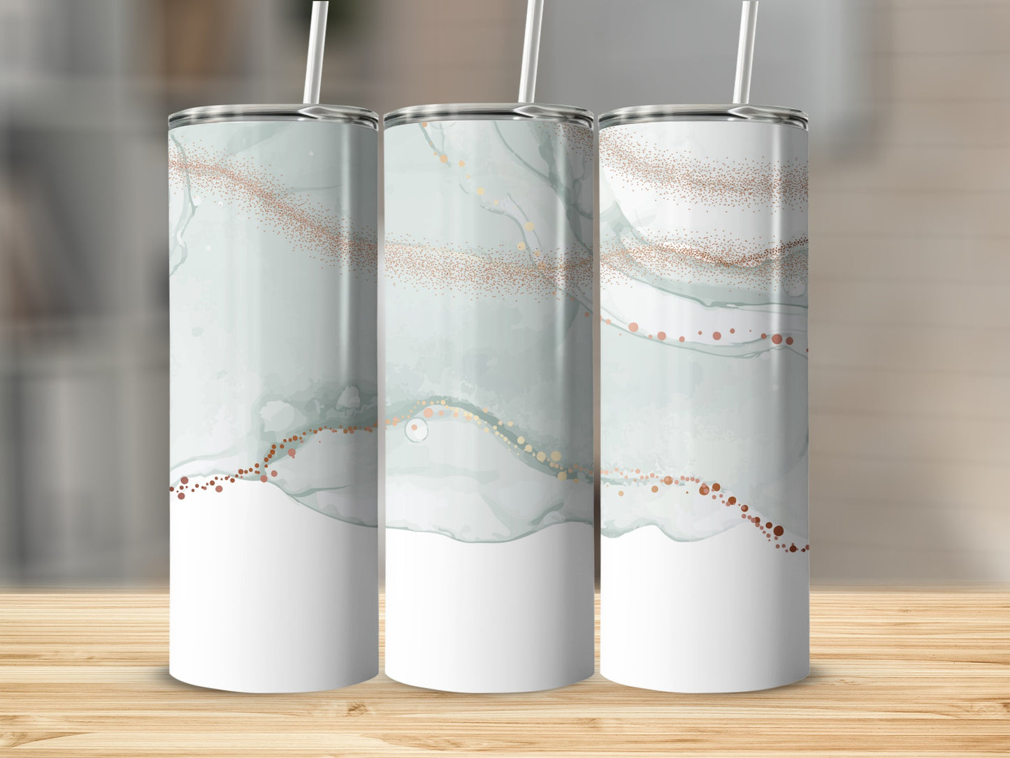 Three tall tumblers with abstract watercolor and glitter design.