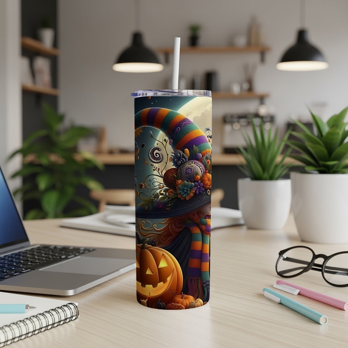 Halloween tumbler featuring a witch hat, pumpkins, and a crescent moon.