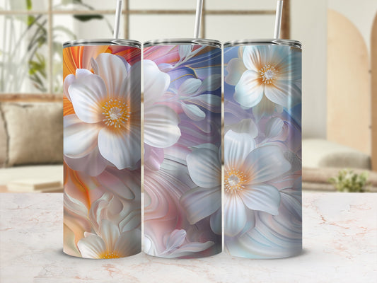 Three tumblers with white floral designs on a marble countertop.