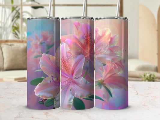 Three tumblers with pink and purple floral designs displayed on a marble countertop.
