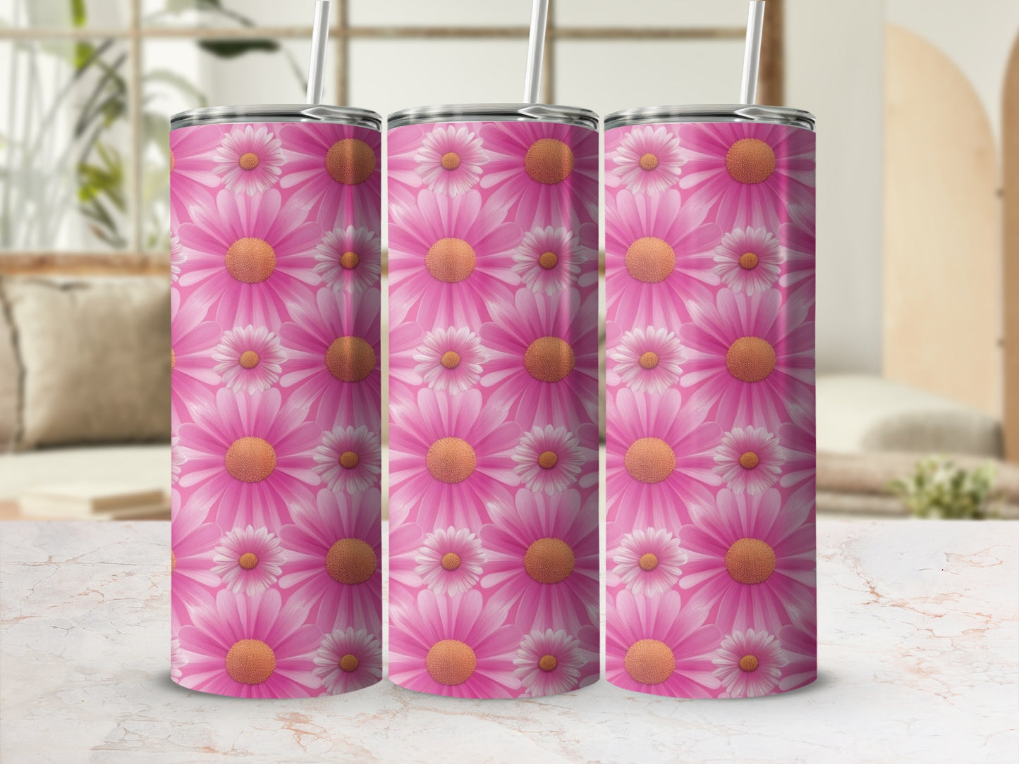 Pink floral pattern on three tumblers with straws.