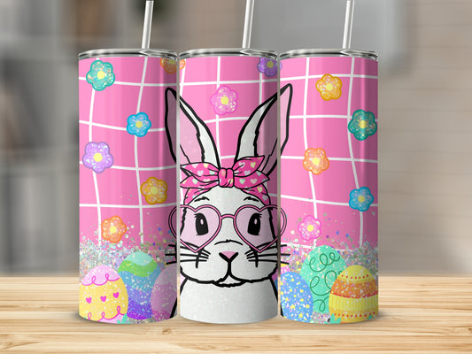 Easter bunny with heart glasses and colorful eggs on a pink grid background.