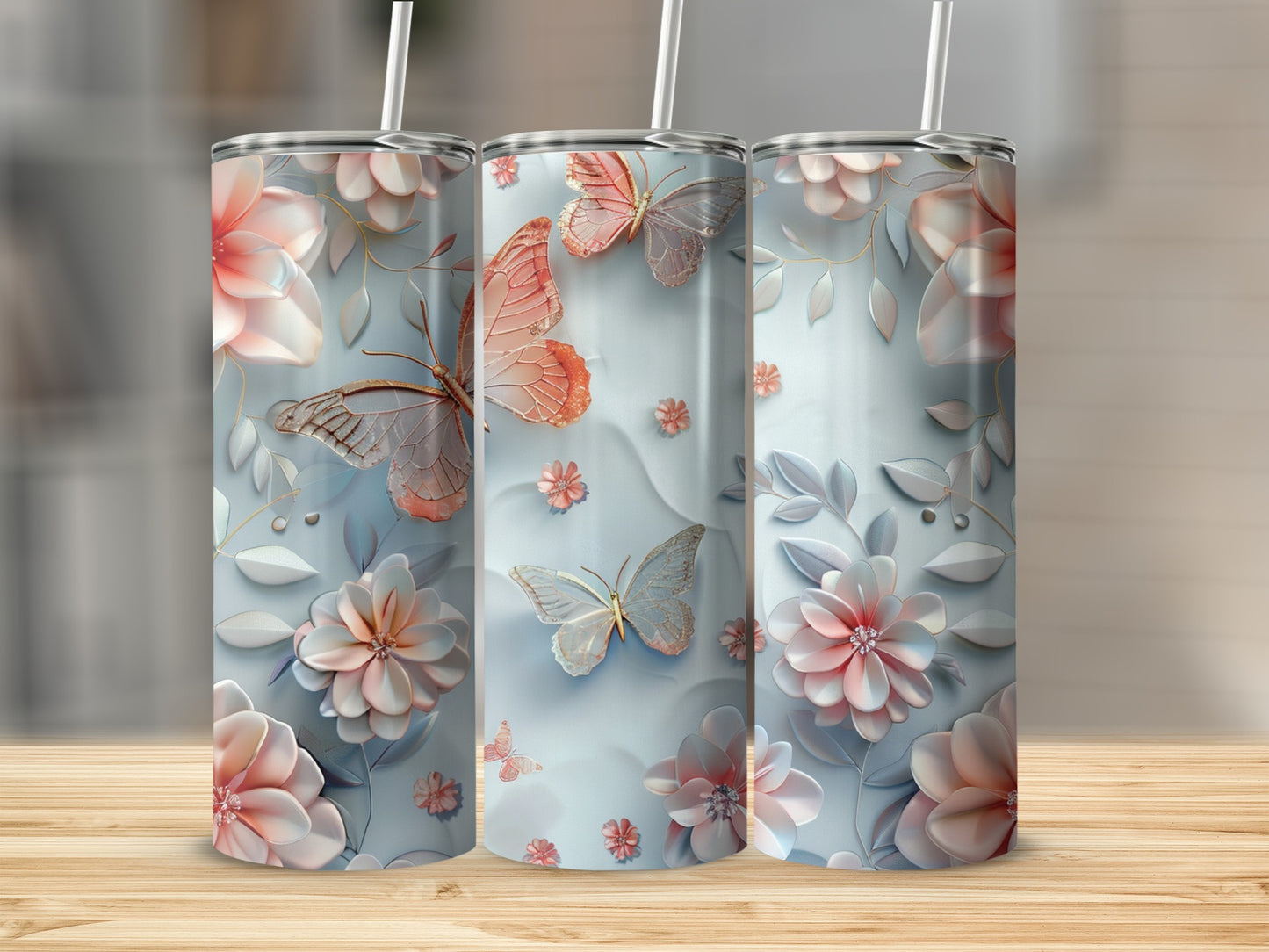 Three floral tumblers with butterflies and gold accents.