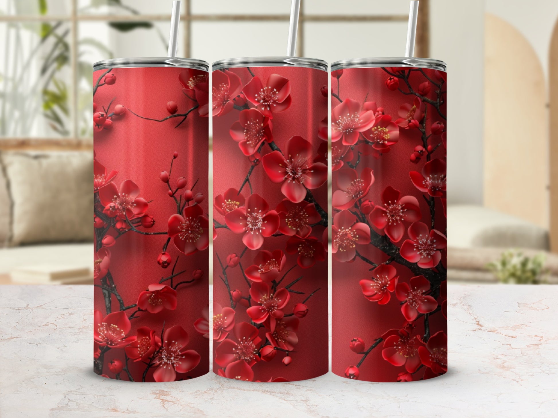 Three red tumblers with a dark red floral cherry blossom pattern.