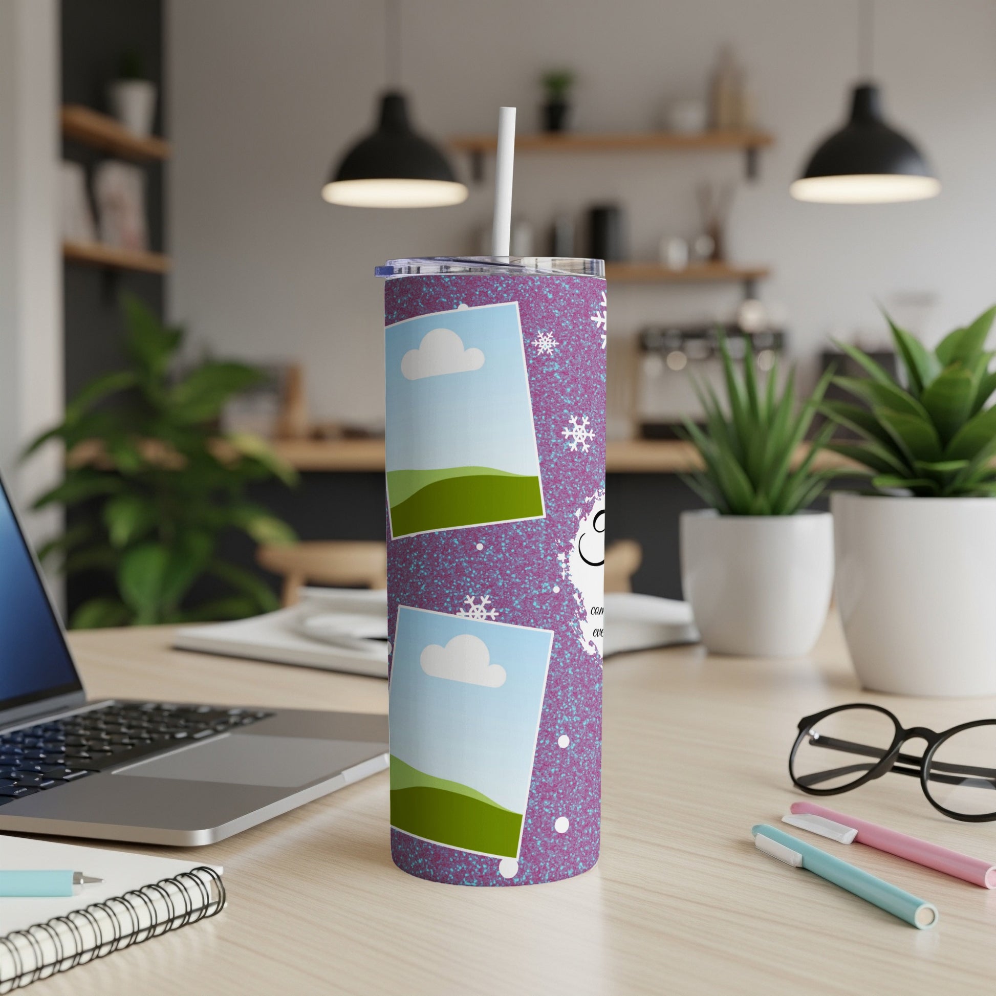 Tumbler with purple glitter, snowflakes, and photo frames with sky and hills.