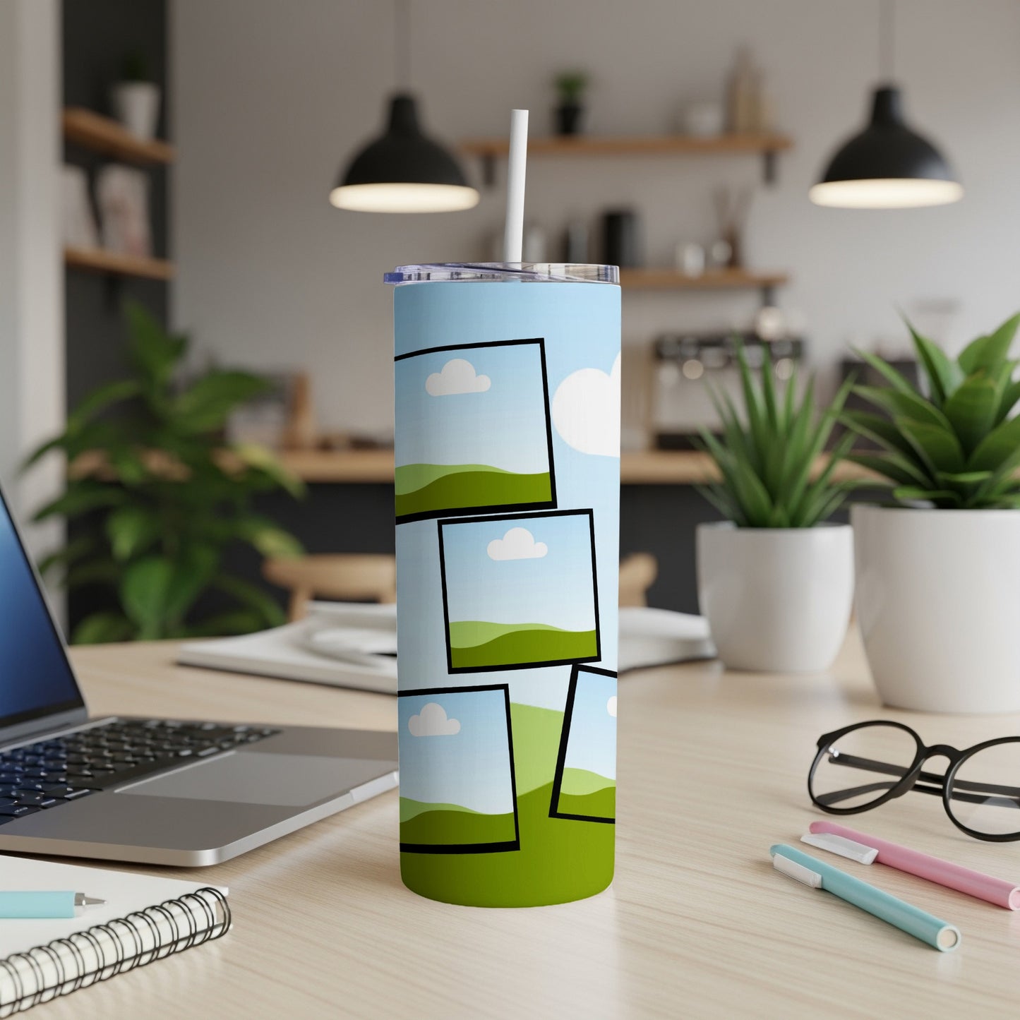 Tumbler with collage of landscape photos and a white straw.