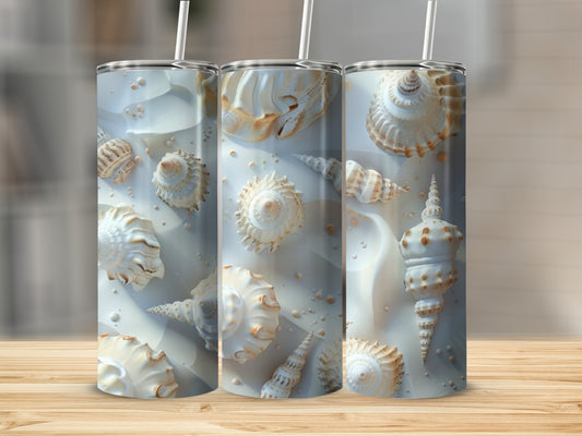 Three tall tumblers featuring detailed seashell patterns on a wooden surface.