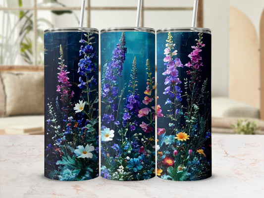 Three tumblers adorned with vibrant wildflowers and foliage.