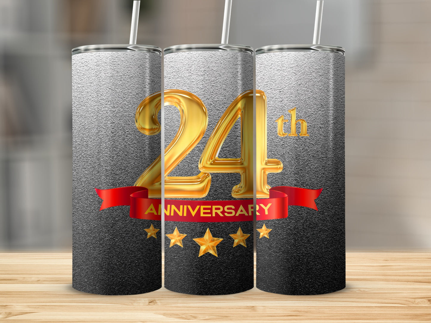 "24th Anniversary" text on a tumbler with gold stars and red ribbon.