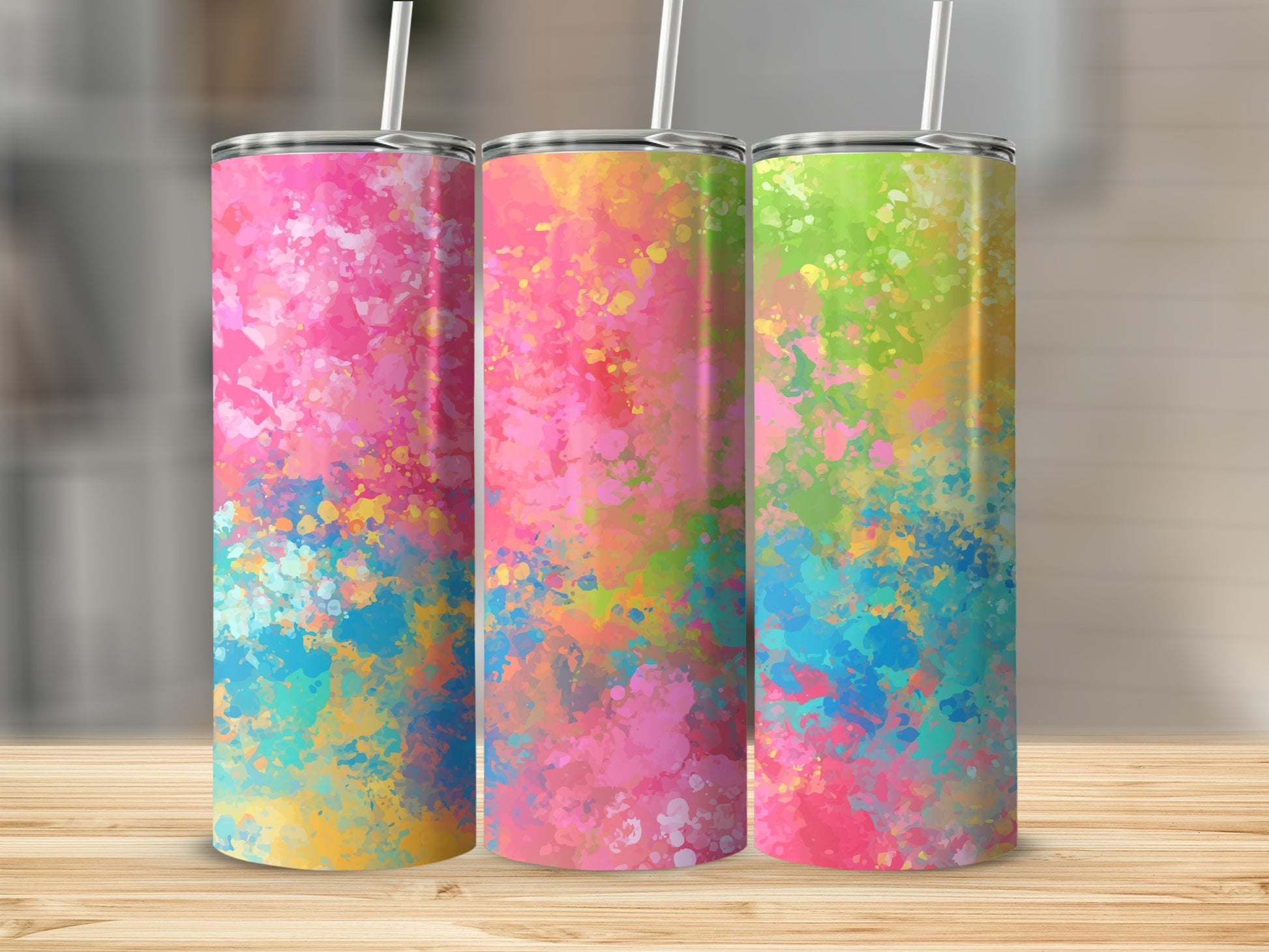 Three tumblers with abstract watercolor-style splash art in pinks, blues, greens, and yellows.