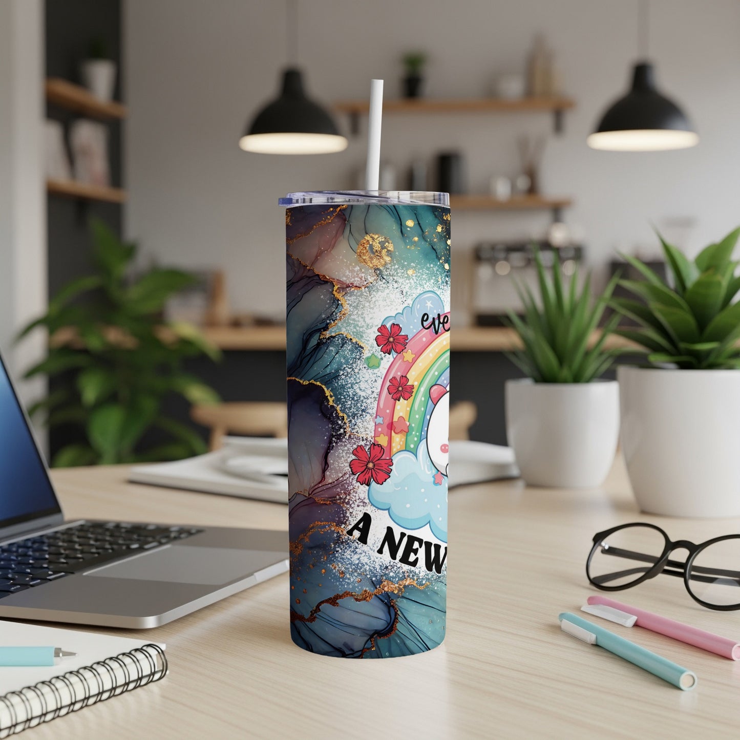 Unicorn with rainbow and "Every day is a new adventure" text on a teal marble tumbler.
