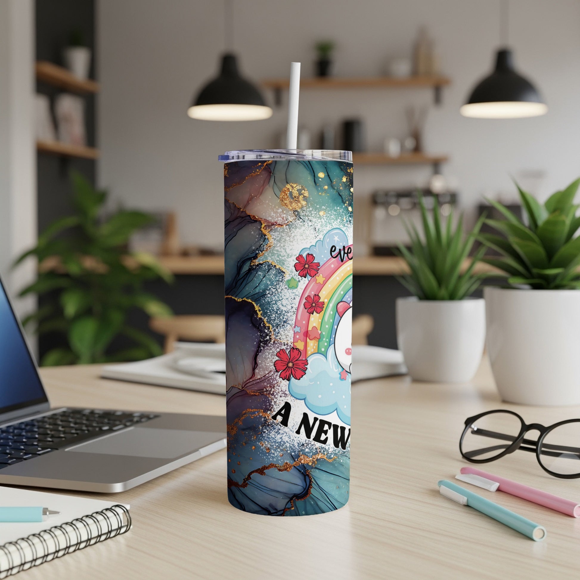 Unicorn with rainbow and "Every day is a new adventure" text on a teal marble tumbler.