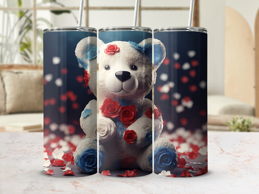 Teddy bear tumbler with red and blue roses and petals.