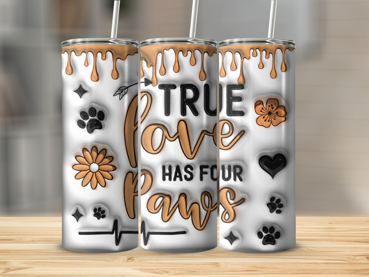 Tumbler with "True Love Has Four Paws" text and paw prints.