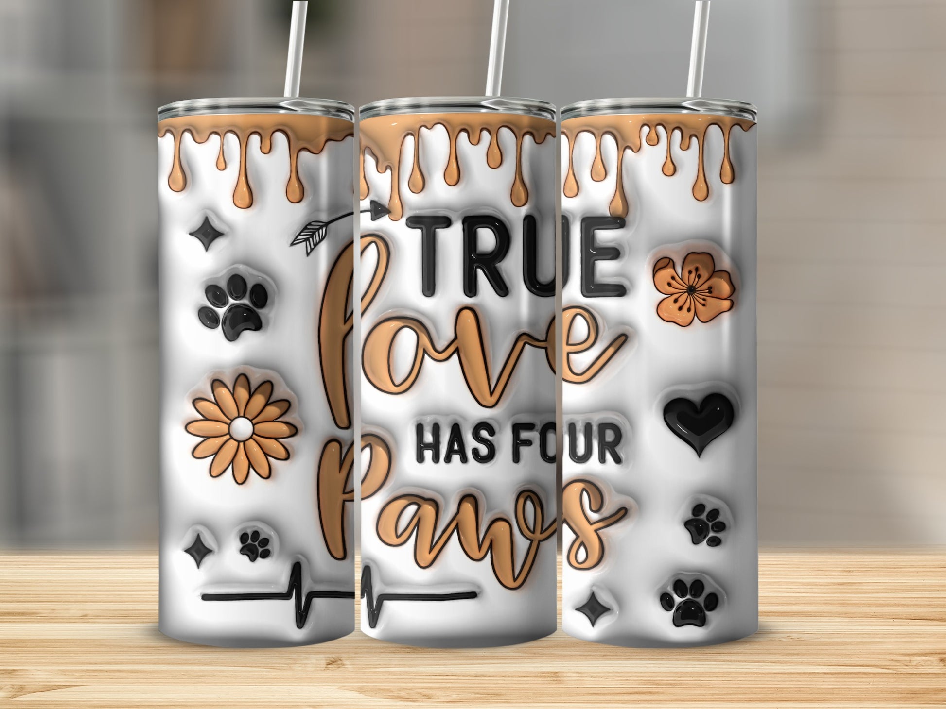 Tumbler with "True Love Has Four Paws" text and paw prints.