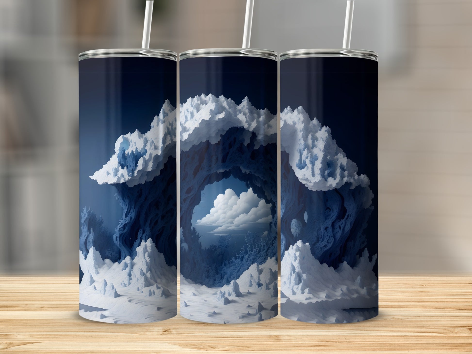 Blue and white abstract cloudy landscape on three tumblers.
