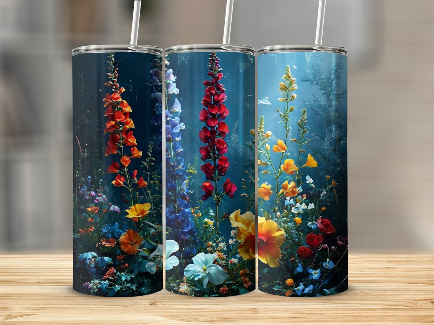 Three tumblers with vibrant floral designs featuring foxgloves and other wildflowers.