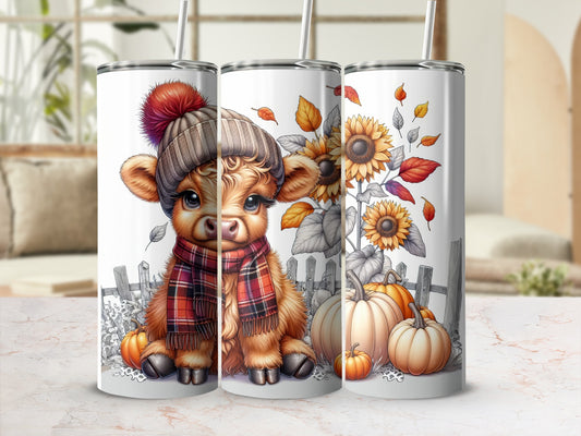 Cute cow in beanie and scarf with pumpkins and sunflowers.