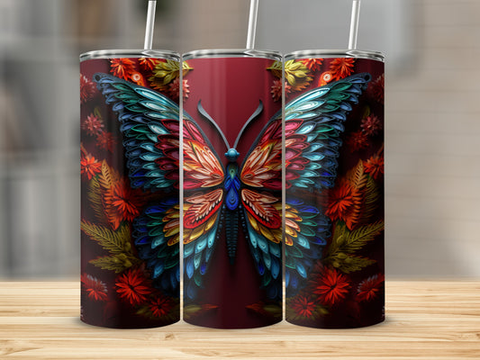 Tumbler with a colorful butterfly and floral design.
