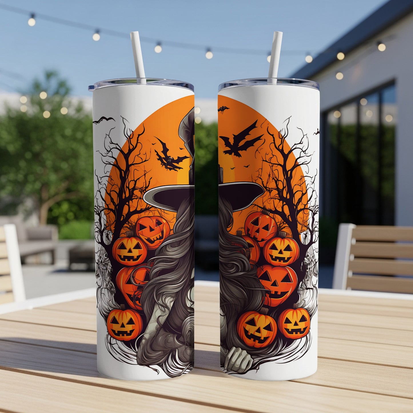 Two tumblers with Halloween art featuring pumpkins, bats, and a witch's hat.