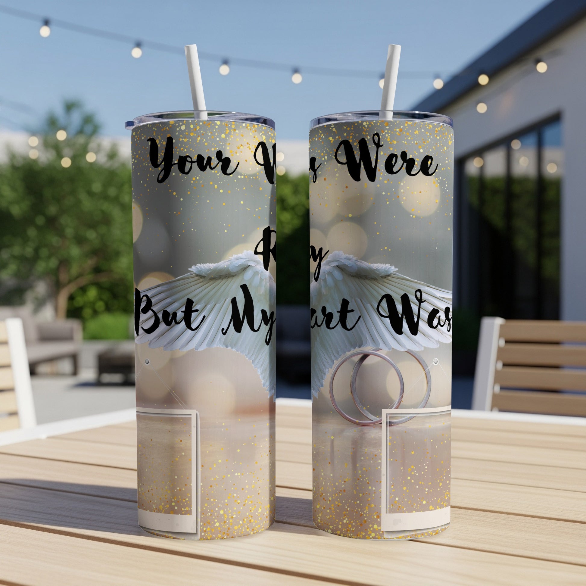 Two tumblers with white wings and gold glitter, reading "Your V...ry Were R...y But My...rt Was".