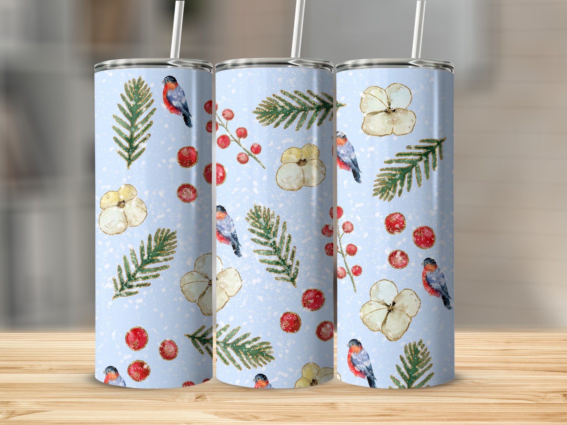Three blue tumblers with a festive bird and floral pattern.