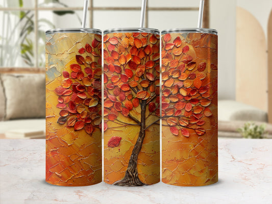 Textured tumbler featuring a vibrant orange tree with falling leaves.