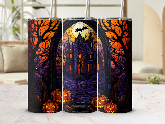 Halloween tumbler with haunted castle, pumpkins, and full moon.