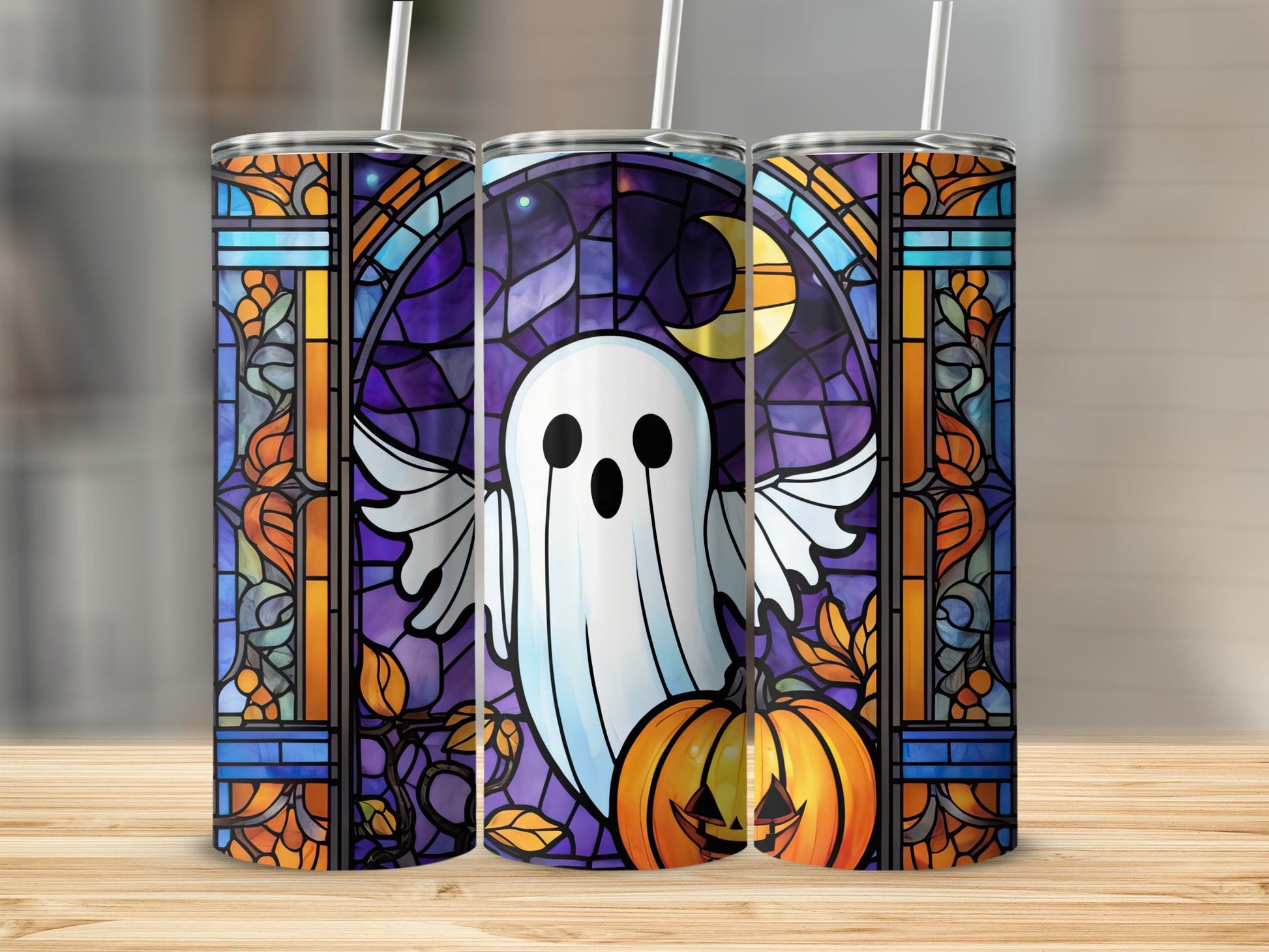 Tumbler with ghost, pumpkin, moon, and stained glass Halloween design.
