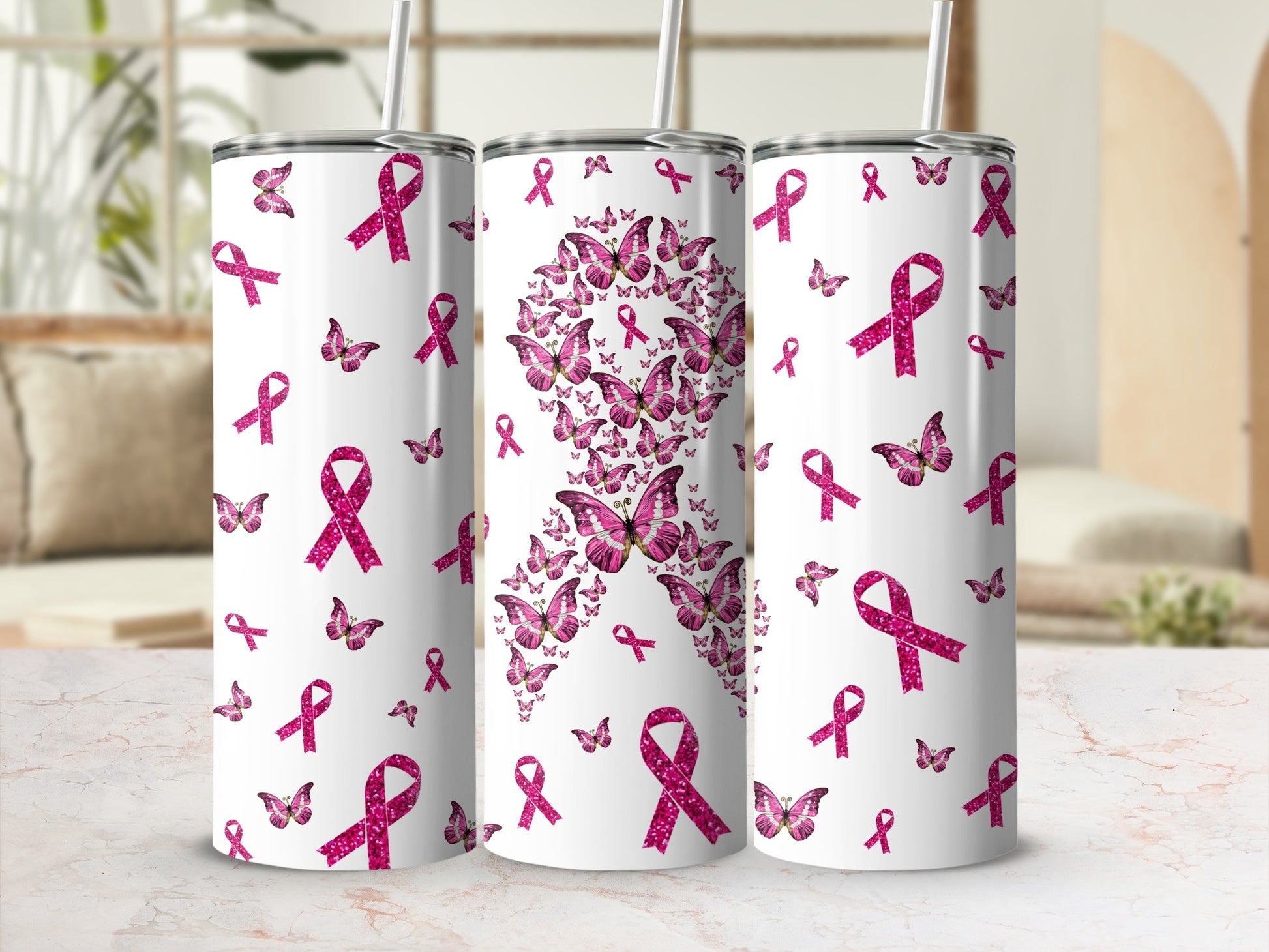 Tapered tumblers adorned with a pink ribbon and butterfly design.