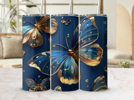 Blue tumbler with ornate gold and blue butterflies and gold lid.