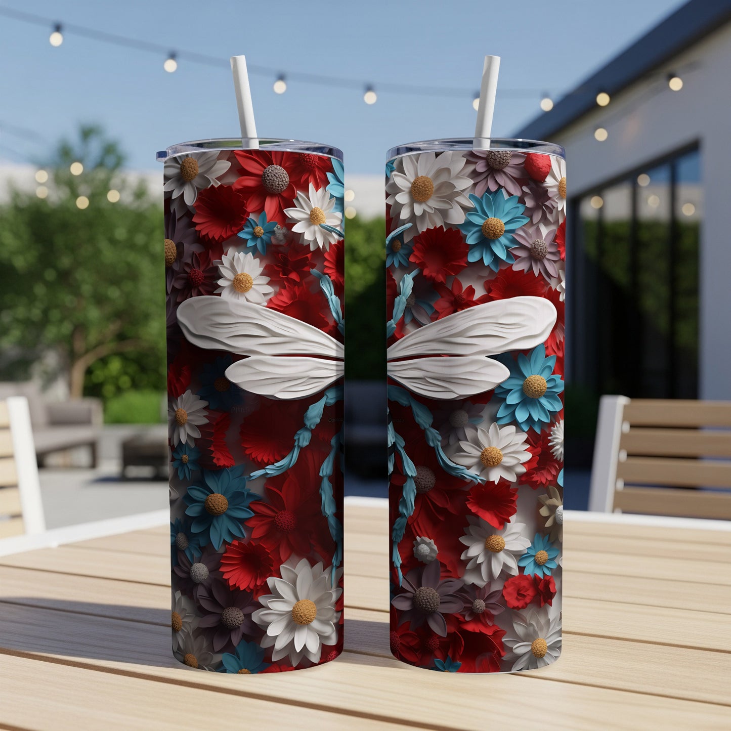 Two tall tumblers with a red, white, and blue floral dragonfly design.