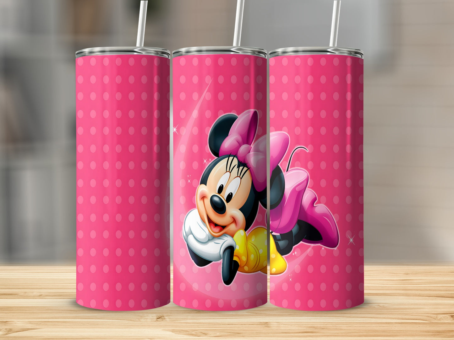 Pink polka dot tumbler with Minnie Mouse graphic.