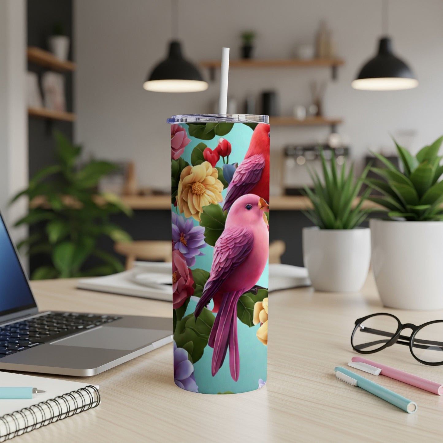 Pink parrots perch among colorful flowers on a tall tumbler.