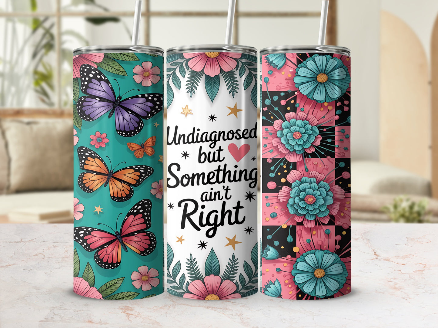Three tumblers featuring butterflies, flowers, and text that reads "Undiagnosed but Something ain't Right".