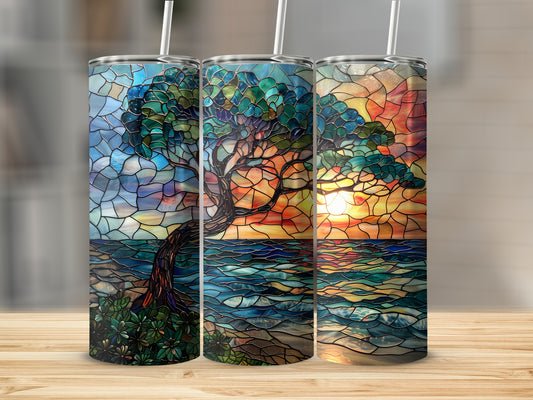 Three tumblers with stained-glass tree and ocean sunset designs.