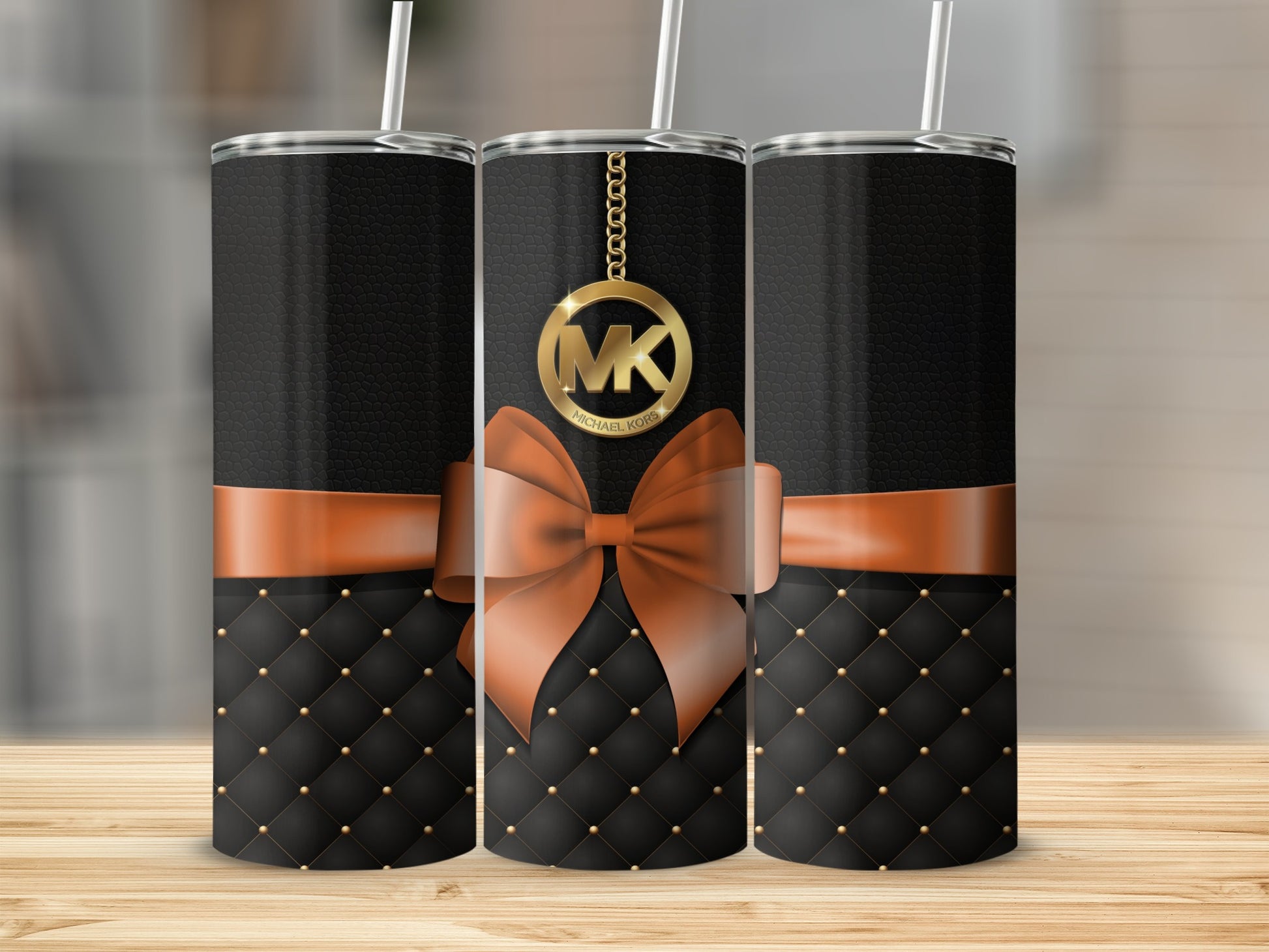 Michael Kors Black and Orange Tumbler with Bow Design