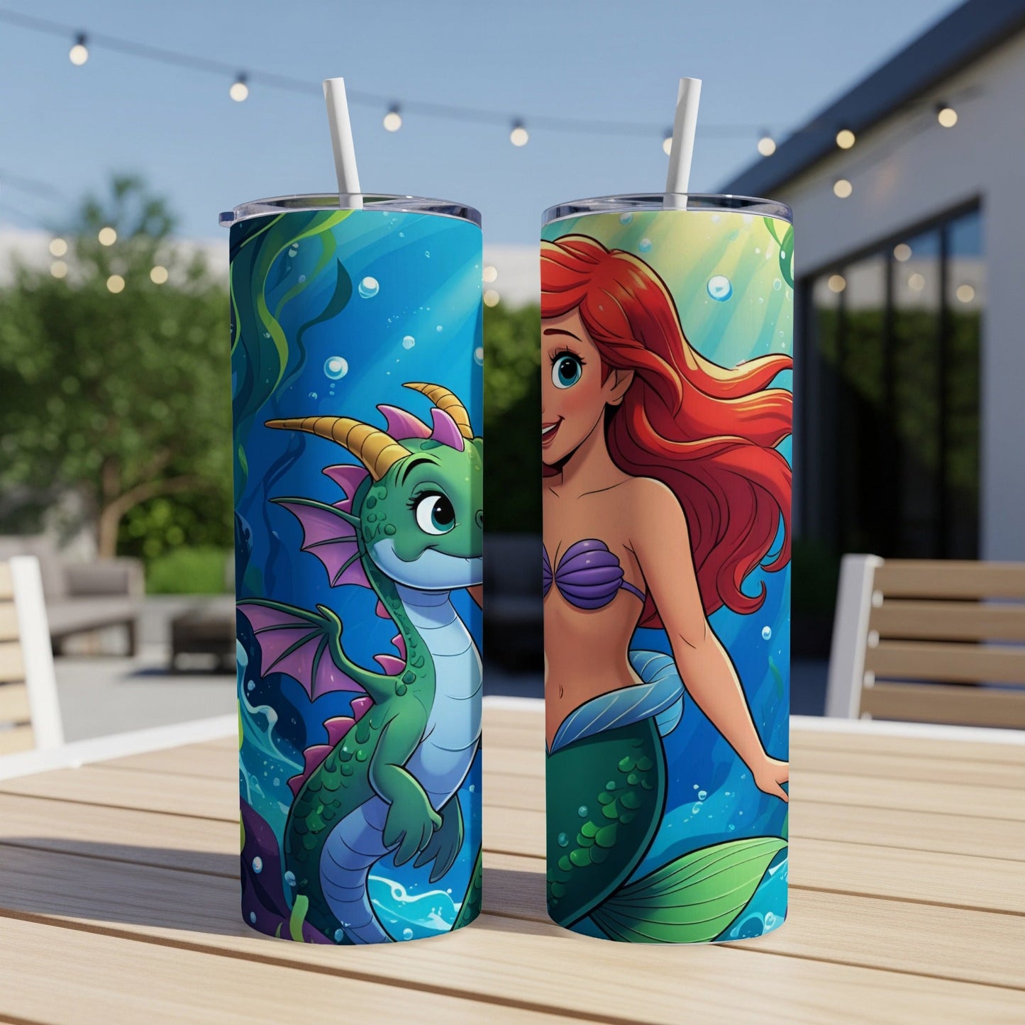 Dragon and mermaid characters on two tumblers sitting on a table.