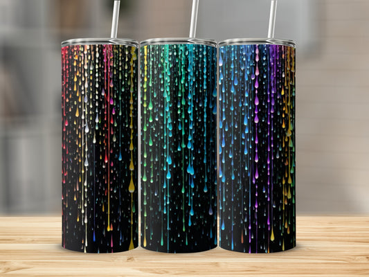 Three black tumblers with colorful dripping paint design and straws.