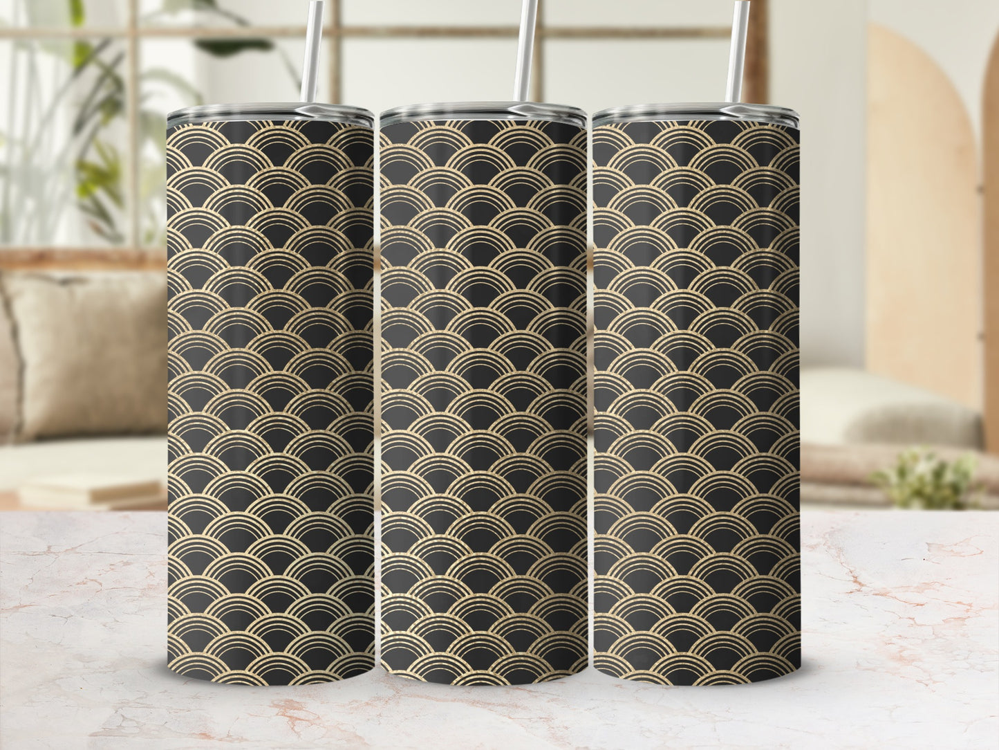 Three tumblers with a repeating gold scallop pattern on a black background.