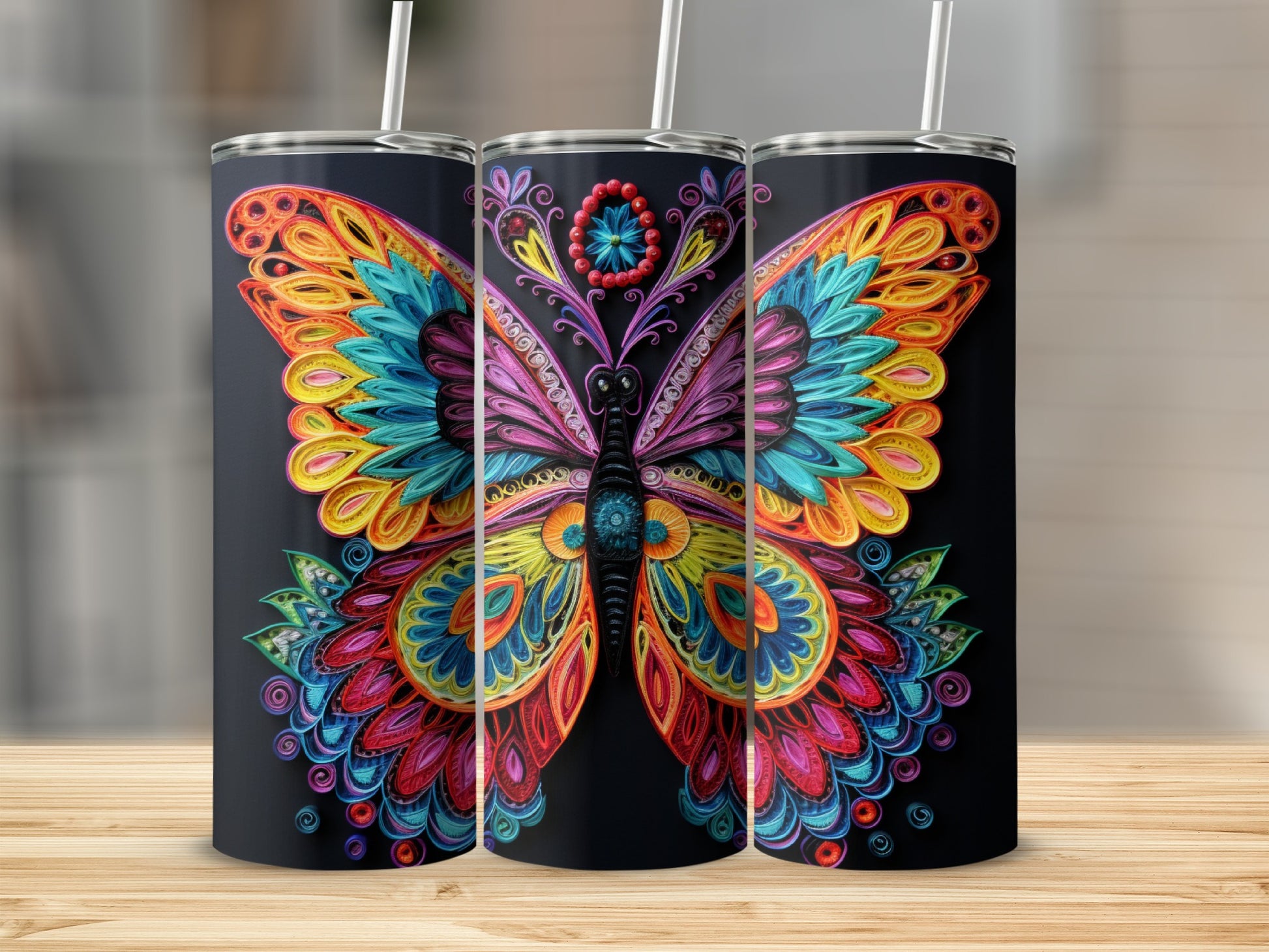 Colorful quilled butterfly design on three black tumblers.