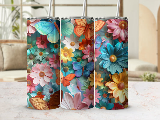 Three tumblers adorned with colorful butterflies and flowers.