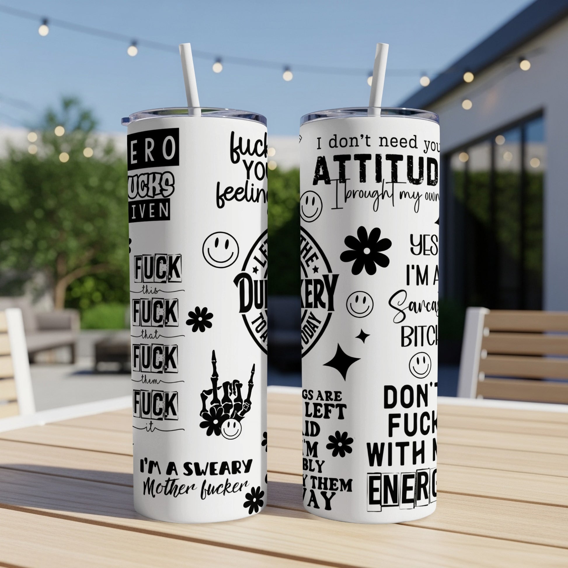 Two tumblers with "fuck you" phrases and skull graphics.