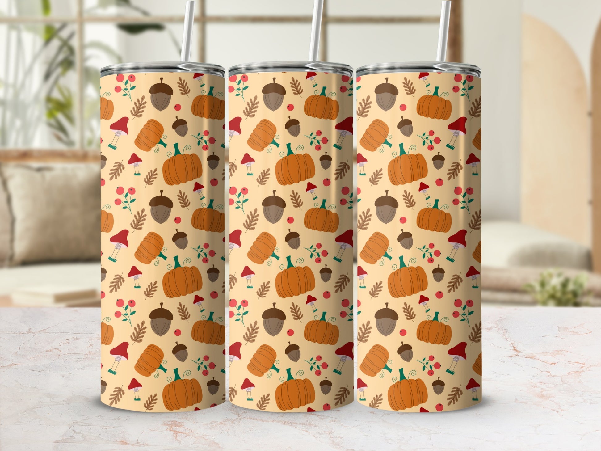 Three tumblers with a fall pumpkin and mushroom pattern.