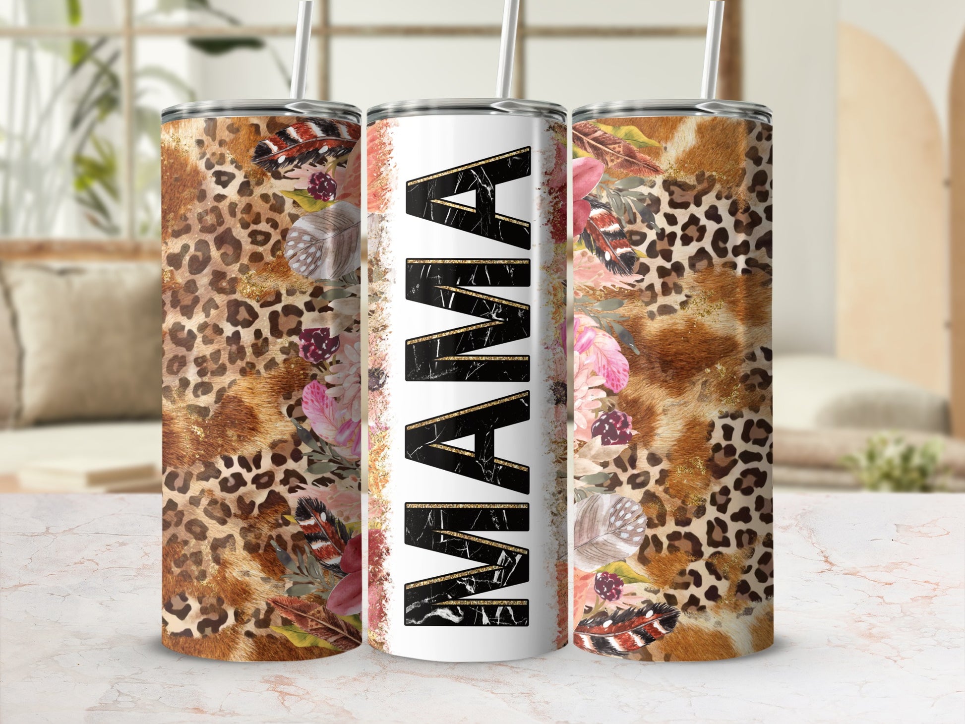 Leopard print, feathers, and floral graphics adorn a tumbler with "MAMA" text.