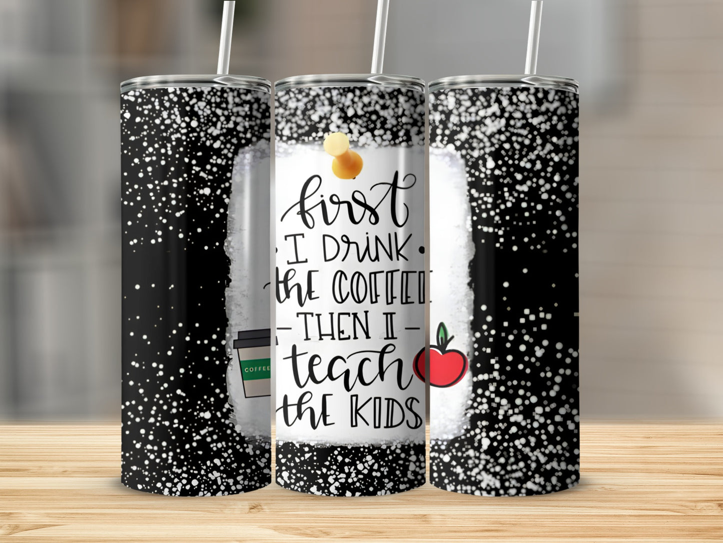 Tumbler with "First I drink the coffee then I teach the kids" text and apple.