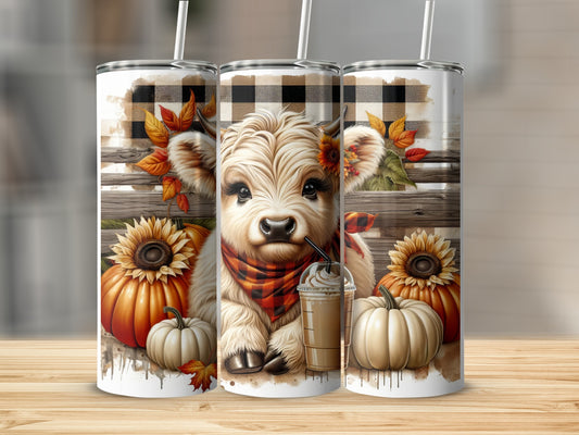 Cute cow wearing a scarf with pumpkins and sunflowers on a tumbler.
