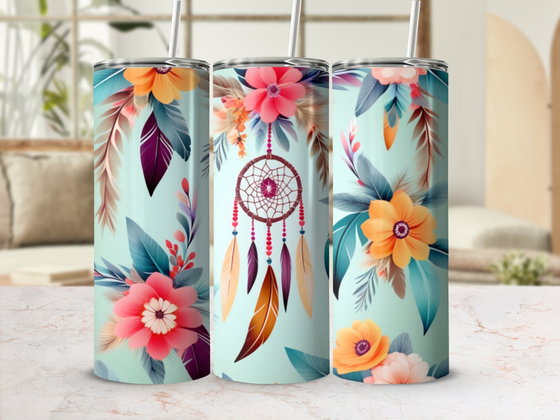 Floral dreamcatcher tumbler with straw and blurred background.