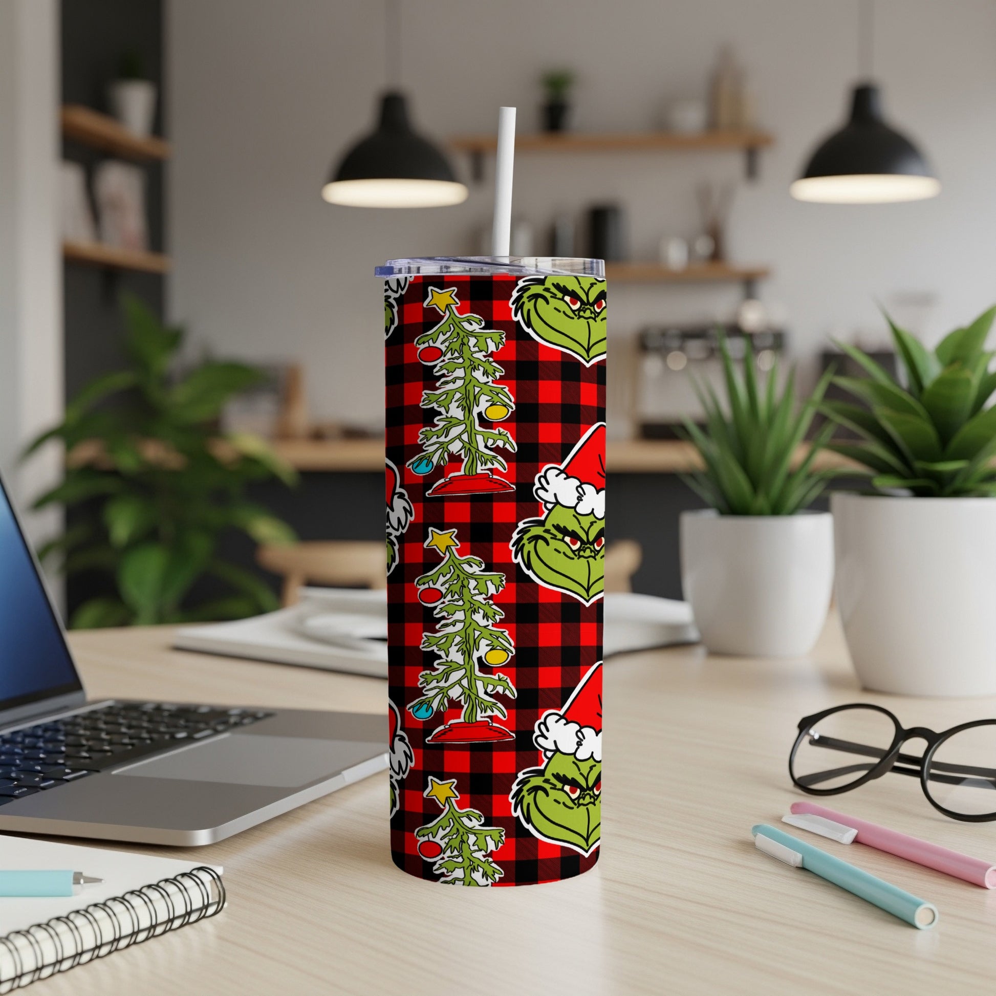 Green Grinch pattern with Christmas trees and red buffalo plaid on a tumbler.